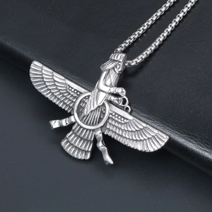 Silver Faravahar pendant necklace with box chain on black textured surface from 45-degree angle