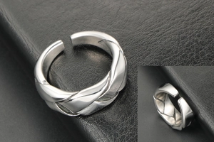 Detail shot of braided texture on adjustable stainless steel hip hop ring for men