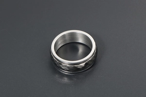 Detail showing the hammered texture and brushed inner finish on the vintage metal ring