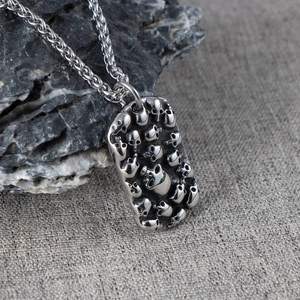 Gothic punk necklace with multiple skull relief pendants on a heavy twisted rope chain
