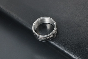 Top view of a vintage punk style rotating ring with a faceted geometric texture finish