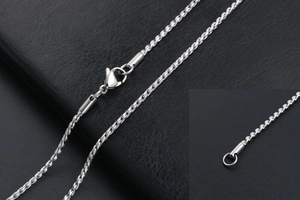 Close-up of silver titanium steel twisted rope chain with a secure lobster clasp closure
