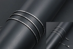 Close-up of silver stainless steel flat link chain with secure lobster clasp fastening