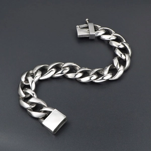 Polished silver titanium steel Cuban link bracelet with a secure square box clasp