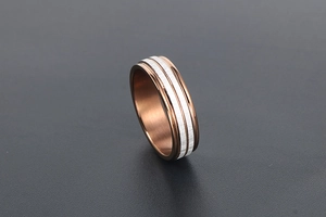 Detail view of coffee-colored brushed titanium steel ring with rose gold finish