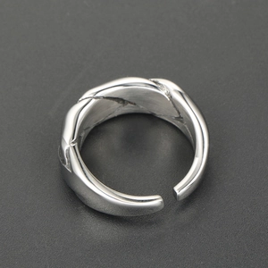 Hip hop style woven stainless steel open ring with polished twisted metallic texture
