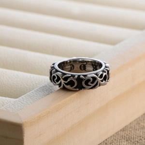 Retro titanium steel ring with intricate gothic floral engravings and silver finish
