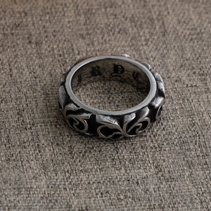 Vintage silver titanium steel ring with intricate floral engraving and gothic inner lettering