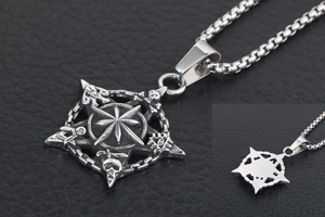 Macro detail of vintage titanium steel necklace pendant with masonic star and all-seeing eye