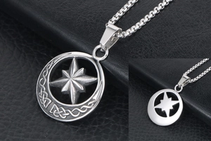 Macro shot of silver crescent moon and star pendant with celtic knot texture on box chain
