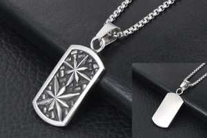 Detail of vintage steel dog tag pendant with star relief and round bead chain