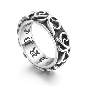 Vintage stainless steel ring with embossed floral pattern and gothic interior engraving
