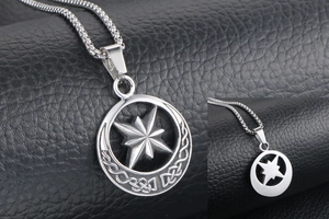 Close-up of titanium steel compass pendant with Celtic knot detail and octagonal star