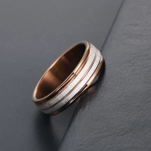 Modern two-tone titanium steel ring with rose gold and brushed silver texture