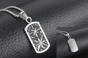 Detail of vintage stainless steel military tag pendant with embossed stars on leather background