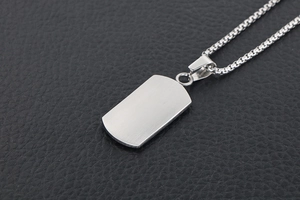 Detail of brushed silver rectangle pendant on a sturdy titanium steel box chain necklace