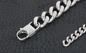 Polished silver punk Cuban link bracelet with large lobster clasp on black leather