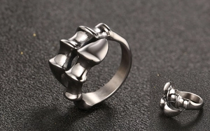 Macro shot highlighting detailed gothic beast bone and claw textures on men's steel ring