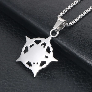 Retro titanium steel box chain necklace with geometric star pendant on leather background