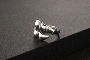 Macro shot showing detailed layered beast claw design of this retro silver steel ring