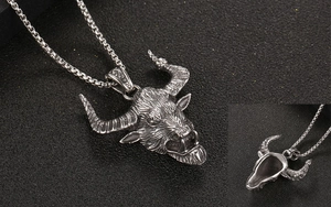 Detailed close-up of retro ox head pendant necklace with textured vintage silver finish