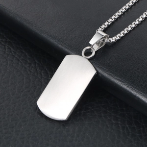 Brushed silver rectangle pendant necklace on a premium black leather background