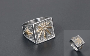 Detail view of square vintage ring with golden leaf relief and retro silver finish