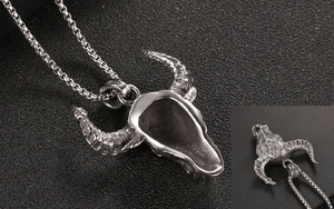 Detailed close-up of retro silver bull skull pendant with fine bone texture and 925 stamp