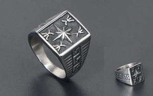 Macro detail of vintage signet ring with compass star and Greek meander patterns