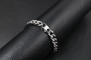 Close-up of vintage titanium steel Cuban link bracelet with a durable lobster clasp