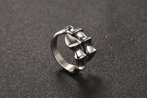 Macro view of vintage animal bone claw ring with detailed stainless steel spine texture