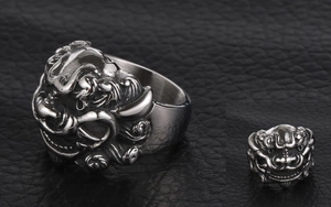 Detail of vintage stainless steel ring featuring 3D embossed Kirin mythical beast design