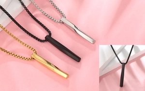 Detailed view of twisted bar necklaces in gold, black, and silver stainless steel