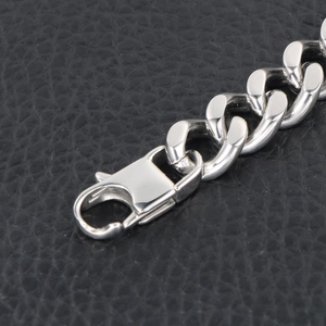 Polished stainless steel cuban link bracelet for men featuring a secure lobster clasp