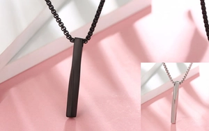 Close-up of minimalist twisted square bar pendant necklaces in black and silver finishes