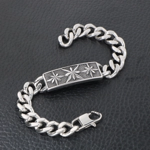 Retro stainless steel curb chain bracelet featuring vintage starburst engravings for men