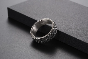 Detailed view of punk-style stainless steel ring with intricate textured dragon scale engraving