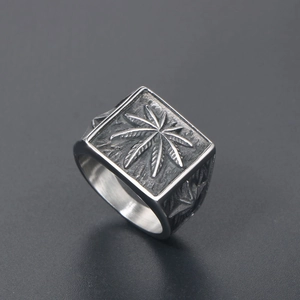 Retro punk stainless steel signet ring with embossed leaf pattern in oxidised finish