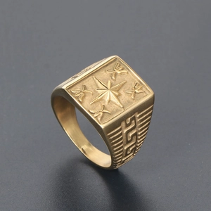 Vintage golden signet ring with star motif and Greek key pattern on the side