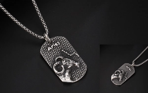 Detail of Aries zodiac necklace featuring a rectangular antique silver ram head pendant
