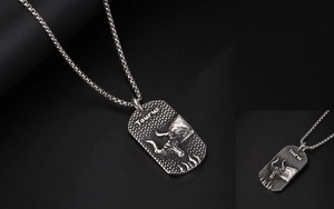 Macro detail of vintage Taurus zodiac pendant showing bull relief and textured finish