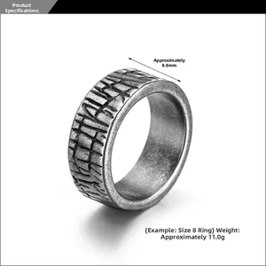 Macro shot of 8.8mm wide vintage brick pattern ring in antique bronze finish