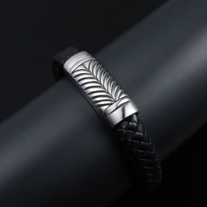 Men's black woven leather bracelet with engraved silver wheat pattern steel clasp