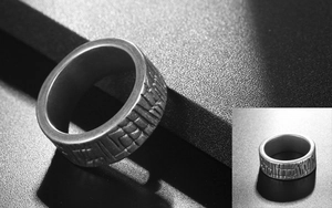 Detail of vintage textured stainless steel wide ring with antique silver finish