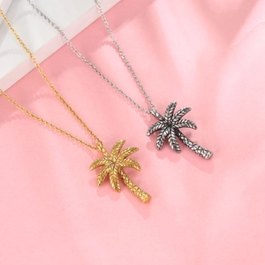 Tropical coconut tree pendants in gold and antique silver with detailed textures