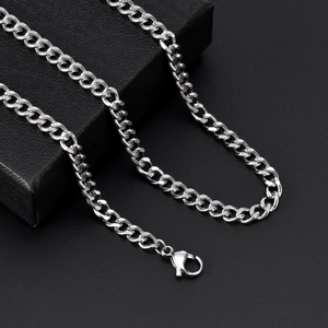 Detailed view of silver titanium steel curb chain with secure lobster clasp closure