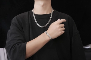 Flat mariner link chain necklace and bracelet set in polished silver steel on male model
