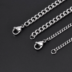 Detail showing four sizes of polished stainless steel curb chains with lobster clasps