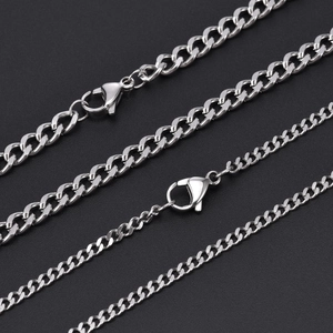 Detail of four different widths of silver titanium steel chains with lobster clasps