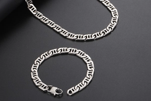 Detailed view of polished stainless steel mariner link bracelet and necklace set